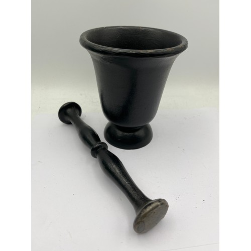 40 - Cast Iron Pestle And Mortar Standing 5”