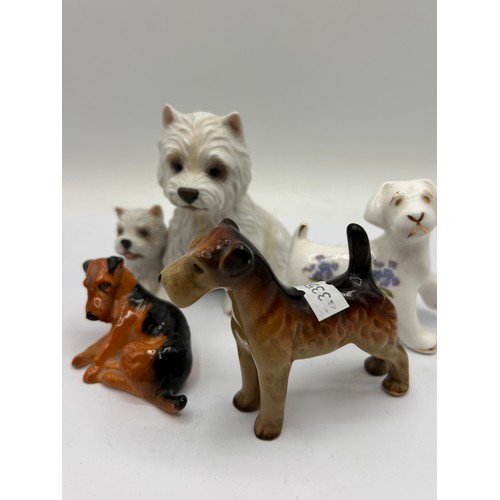 202 - Collection Of Dog Figures Including Osbourne , Midwinter Etc. Tallest 4