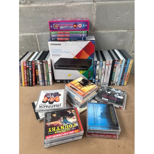 512 - A Polaroid Compact HDMI DVD Player, with a Collection of DVDs and CDs
