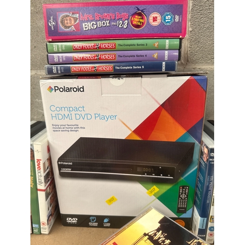 512 - A Polaroid Compact HDMI DVD Player, with a Collection of DVDs and CDs