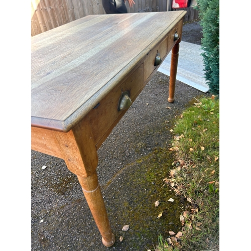 24 - A Late 19th/Early 20th Century Rustic Oak Table with Three Drawers