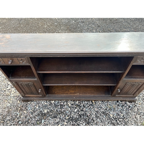 41 - An 'Old Charm' Oak Bookcase by Wood Bros, with Drawers and Cabinets