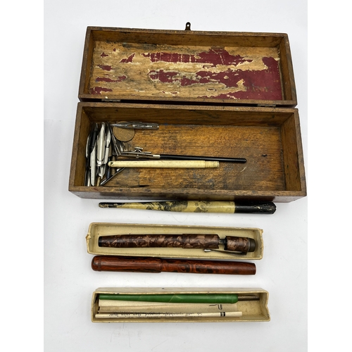 A Collection of Writing Instruments and Two Boxes, including a French ...
