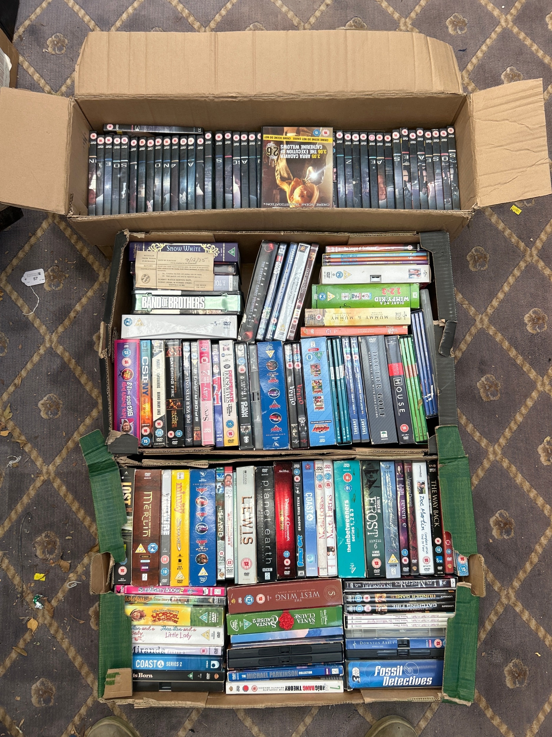 A Collection of DVDs and Blu-rays in Three Cardboard Boxes