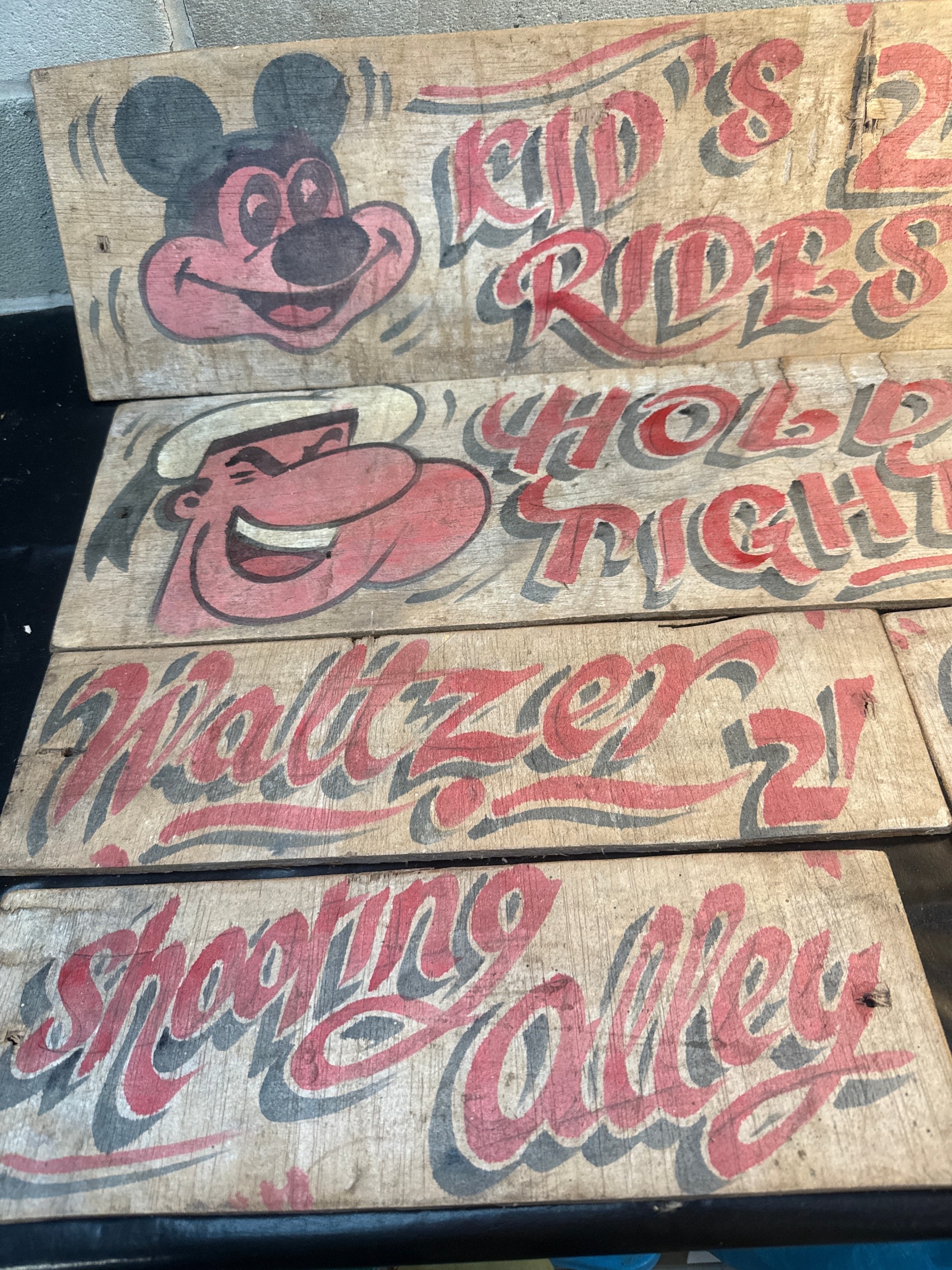 A Group of Five Vintage Hand-Painted Wooden Fairground Signs
