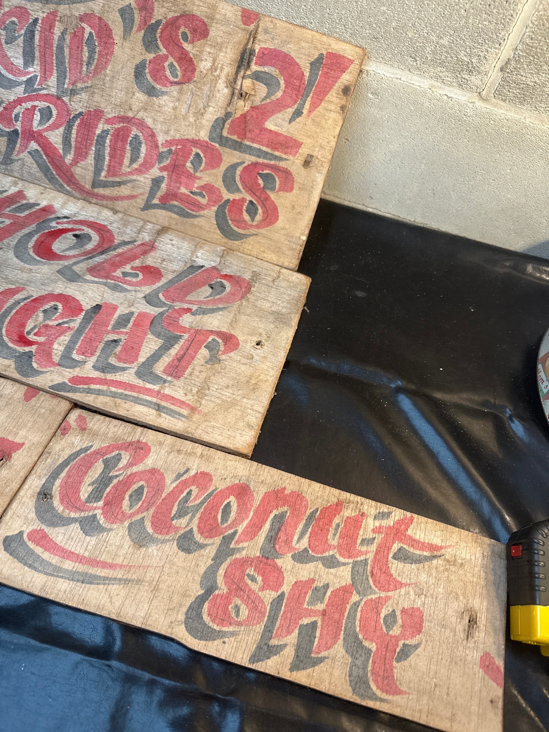 A Group of Five Vintage Hand-Painted Wooden Fairground Signs