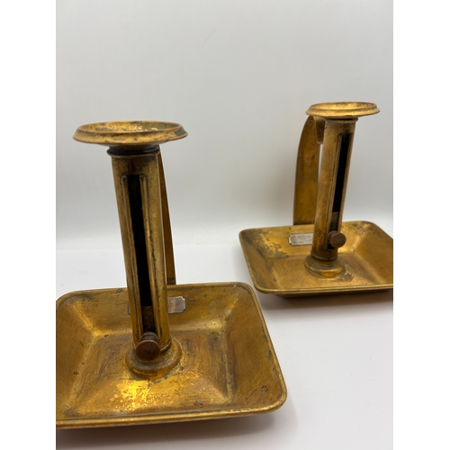 105 - A Pair of English Brass Ejector Chambersticks, Dated 1912