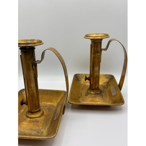 105 - A Pair of English Brass Ejector Chambersticks, Dated 1912