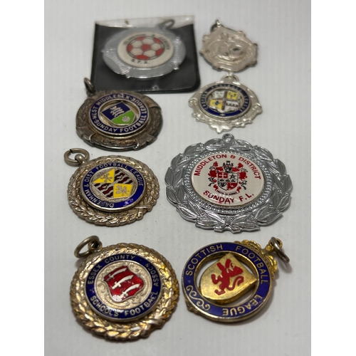 112 - A Collection of Eight Vintage English and Scottish Football League Medallions and Fobs