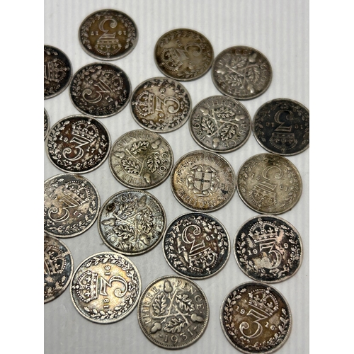 117 - A Collection of 23 British Silver Threepence Coins, George V and George VI Era