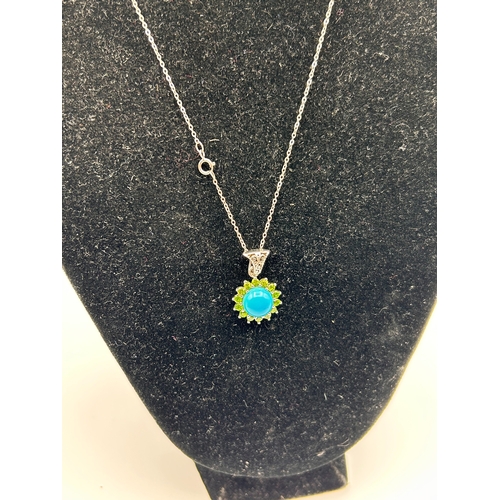 63 - A Silver Turquoise and Peridot Sunburst Pendant Necklace