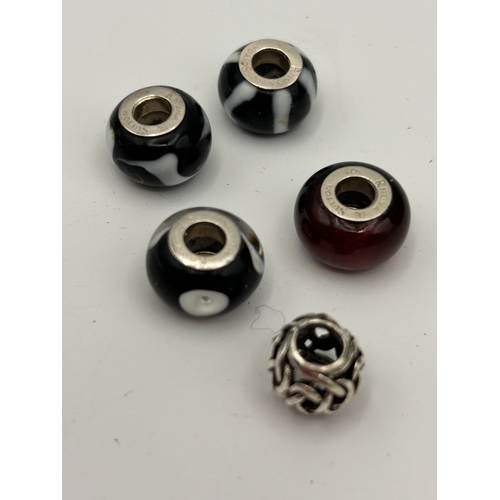 74 - A Collection of Five Sterling Silver Rhona Sutton Charm Beads
