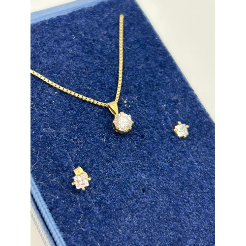 84 - Three-Piece Gold Jewelry Ensemble with Solitaire Pendant and Stud Earrings, 2.7g