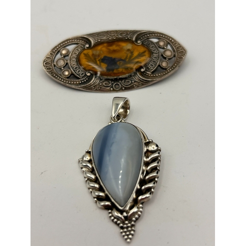 85 - A Silver Pendant Along With Butterfly Wing Brooch.