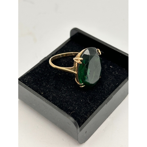 92 - A 9ct Gold Cocktail Ring Set with a Large Oval Created Emerald Stone