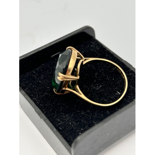 92 - A 9ct Gold Cocktail Ring Set with a Large Oval Created Emerald Stone