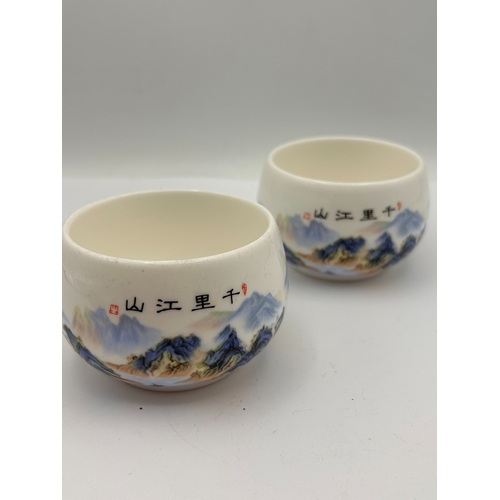 99 - A Pair of Chinese Qianli Jiangshan Polychrome Porcelain Tea Cups