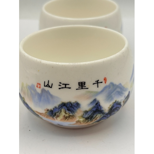 99 - A Pair of Chinese Qianli Jiangshan Polychrome Porcelain Tea Cups