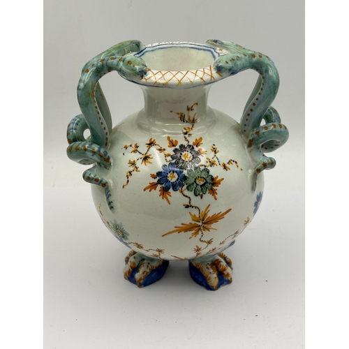 39 - A Polychrome Glazed Earthenware Vase with Serpent Handles and Claw Feet