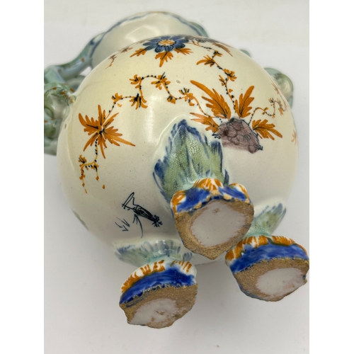 39 - A Polychrome Glazed Earthenware Vase with Serpent Handles and Claw Feet