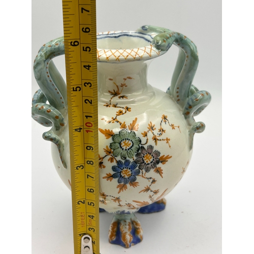 39 - A Polychrome Glazed Earthenware Vase with Serpent Handles and Claw Feet