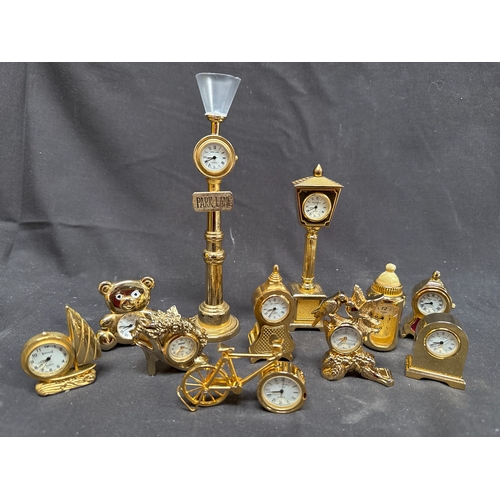 15 - A Collection of 11 Miniature Brass Novelty Quartz Clocks