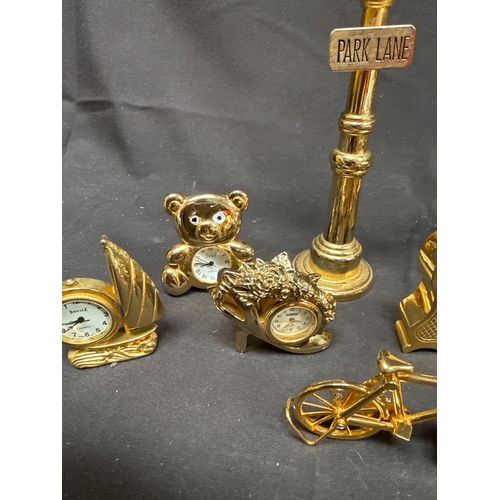 15 - A Collection of 11 Miniature Brass Novelty Quartz Clocks