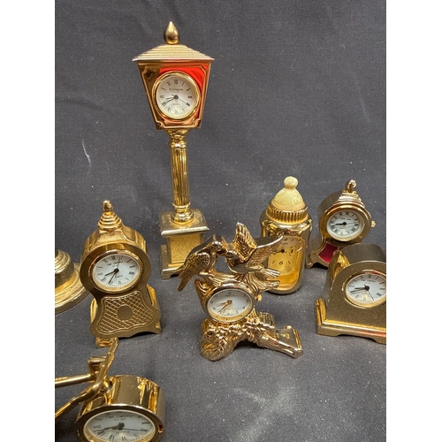 15 - A Collection of 11 Miniature Brass Novelty Quartz Clocks