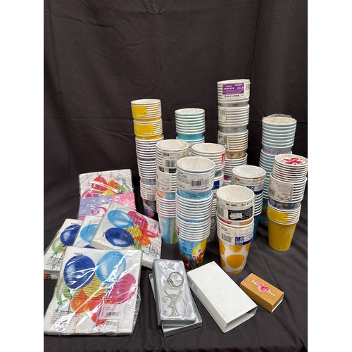 28 - An Assortment of Disposable Paper Party Cups, Napkins, and Decorative Items