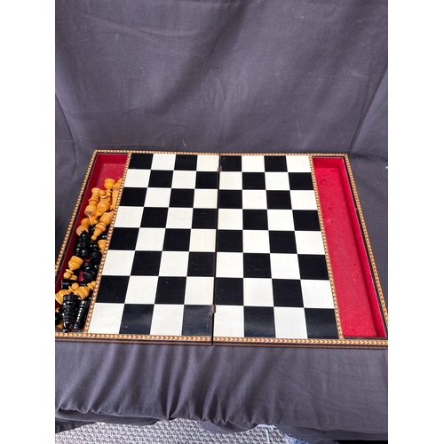 58 - A Large Middle Eastern Style Marquetry Inlaid Wooden Folding Chess Set