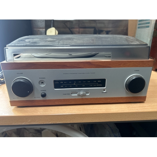 Two Vintage Integrated Stereo Turntable Systems