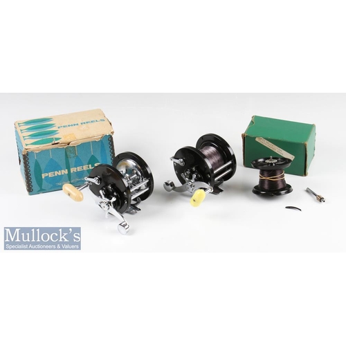 111 - Penn Demar 285 Multiplier Reels (2) both with black bodies having chromed fittings, one with yellow ... 