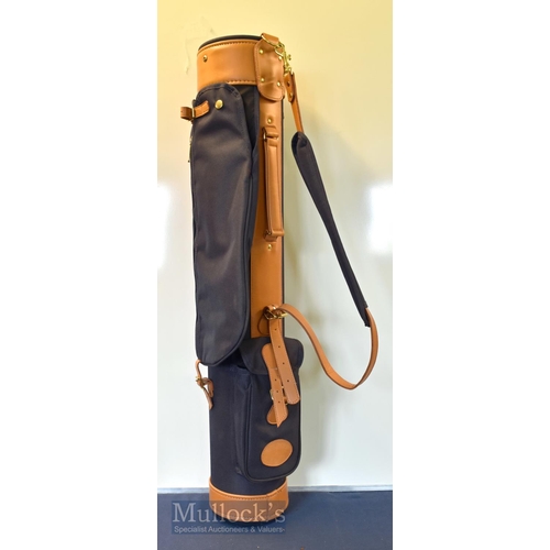 130 - Unused canvas and leather modern rigid tube golf club carry bag with travel hood and ball pocket, co... 