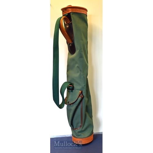 134 - Green canvas and brown leather collapsible golf club carry tube bag with oval top, ball pocket and u... 