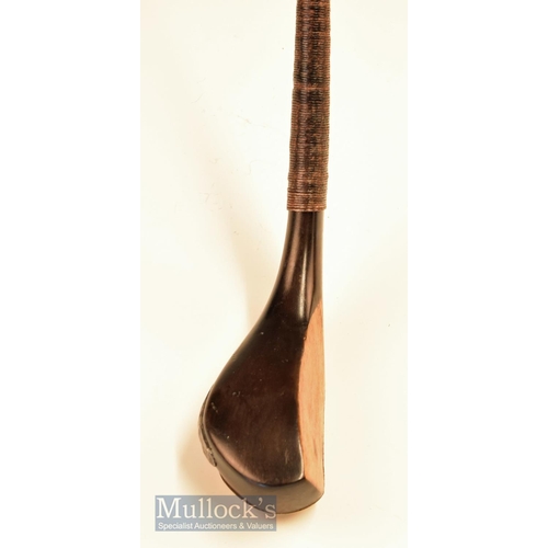 229 - T Dunne narrow wide head dark stained baffing spoon c1880 fitted with full brass sole plate stamped ... 