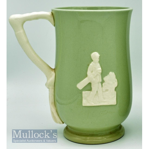 165 - Spode Copeland Golfing Tankard: green tankard with white relief golfing figures and handle, height 1... 