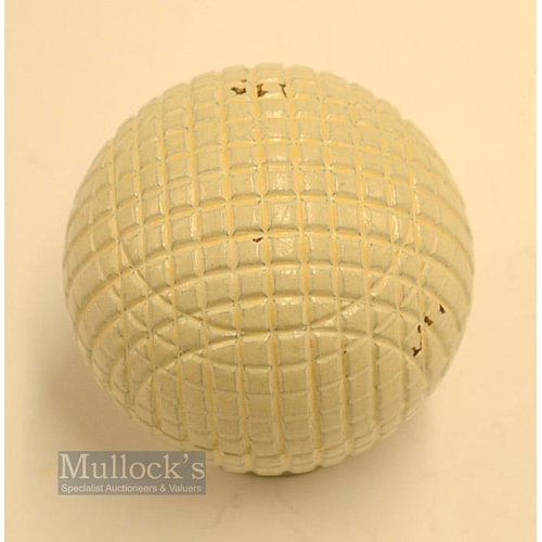 26 - Fine and original and unused moulded mesh small guttie golf ball - unused with all the original whit... 