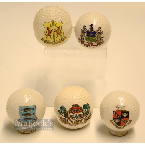 426 - Collection of Ceramic Crested Ware Bramble Pattern Golf Balls (5): 2x mounted on golf tee style base... 