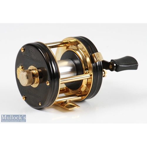 28 - ABU Ambassadeur 5500CDL Tribute 1974-2014 reel in black and gold finish, limited edition 110-250 sta... 