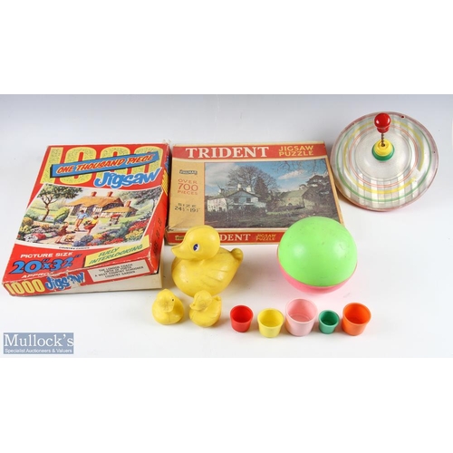 150 - A Selection of Vintage Toys to include a plastic spinning top, plastic duck set, jigsaws, teach your... 