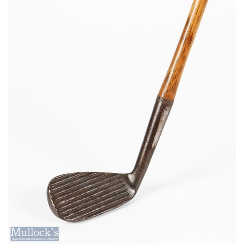 297 - Deep wide grooved face mashie niblick - with 'flower and bee' cleek marks and indistinct marks, c/w ... 