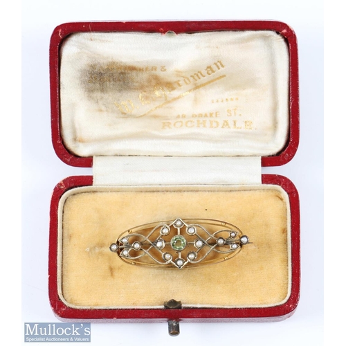 146C - Edwardian 9ct Gold Peridot and Seed Pearl Brooch marked to rear ‘9ct’, length 4cm, weight 2.8 grams,... 