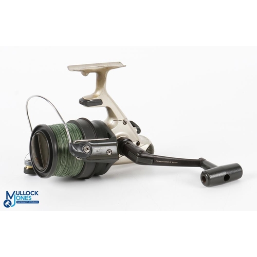 Daiwa 5500T fixed spool spinning reel, good bail, coil spring loaded drag,  runs very well, light use