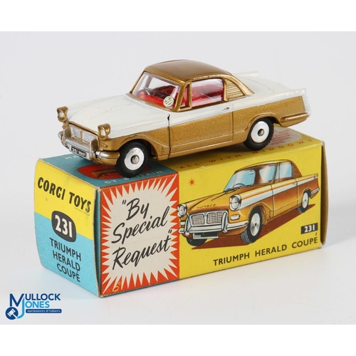 202 - Corgi 231 Triumph Herald Coupe. boxed. Gold and white version with flat spun wheels in v light used ... 