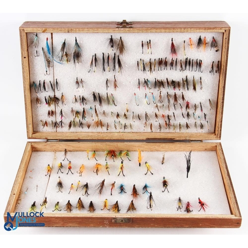 55 - A large collection of sea trout and low water salmon double and single flies in 4-sided hinged wood ... 