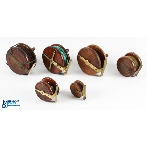 110a - A collection of 7x brass/mahogany centre pin reels from 2