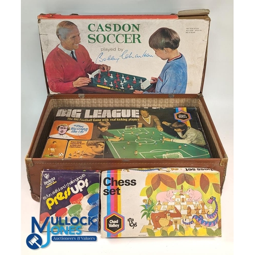 208a - Vintage Board Games: an old suit case with contents of Casdon Soccer played by Bobby Charlton, Chad ... 