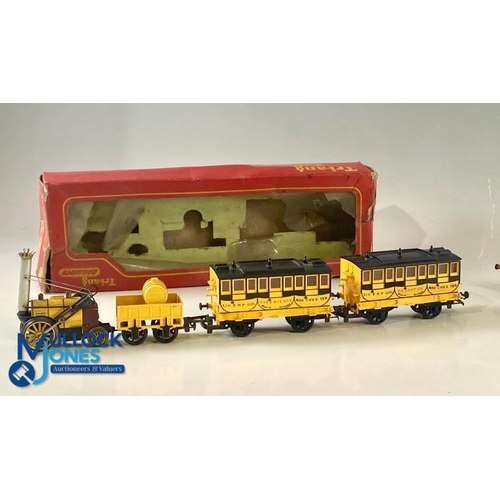 244 - TRIANG R346 Stephenson's Rocket Triang Complete with 2 Coaches (1964) a worn box, plus, a Triang Lor... 