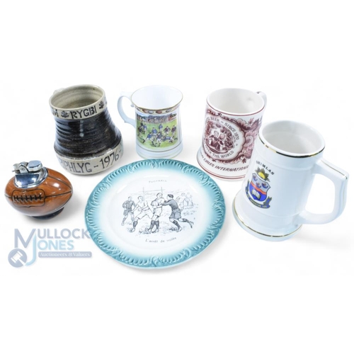 356 - Rugby Ceramics (6): 1900s green/white French china plate with rugby action scene; 1976 Welsh Grand S... 