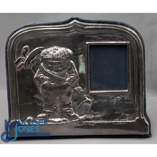 417 - A Silver Hallmarked golf themed easel back photograph frame, by John Bull Ltd, London 1994, repousse... 